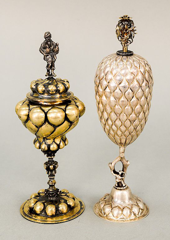 Appraisal: Two silver covered chalices one marked sterling with floral finial