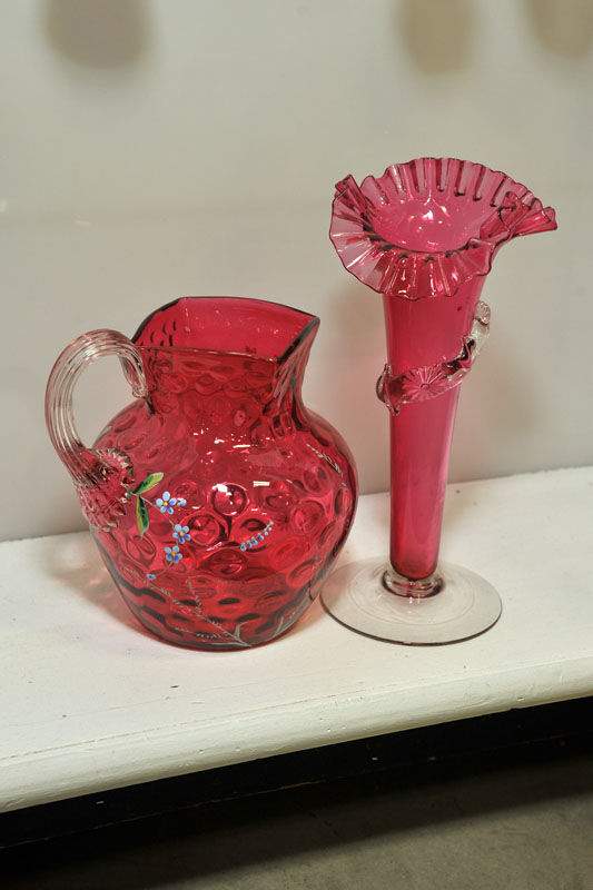 Appraisal: TWO PIECES OF VICTORIAN ART GLASS A cranberry thumbprint pitcher