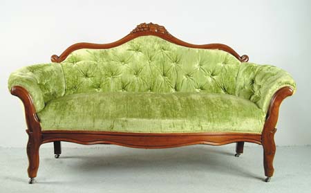 Appraisal: GRAPE CARVED WALNUT VICTORIAN SOFA Lime green tufted upholstery serpentine