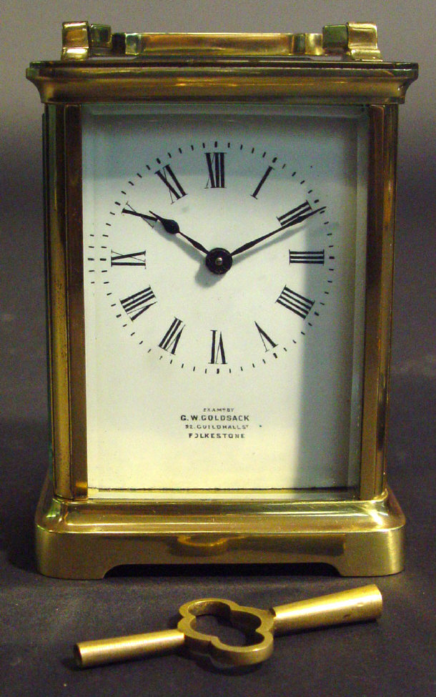 Appraisal: Brass cased carriage clock with bevelled glass panels and enamel