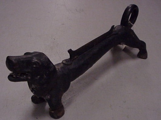 Appraisal: Dachshund dog boot scraper cast iron exaggerated body curled tail