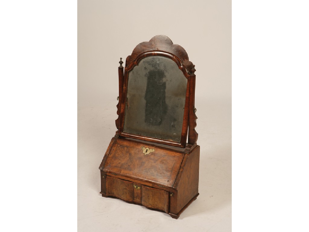 Appraisal: A QUEEN ANNE WALNUT DRESSING TABLE MIRROR the shaped mirror