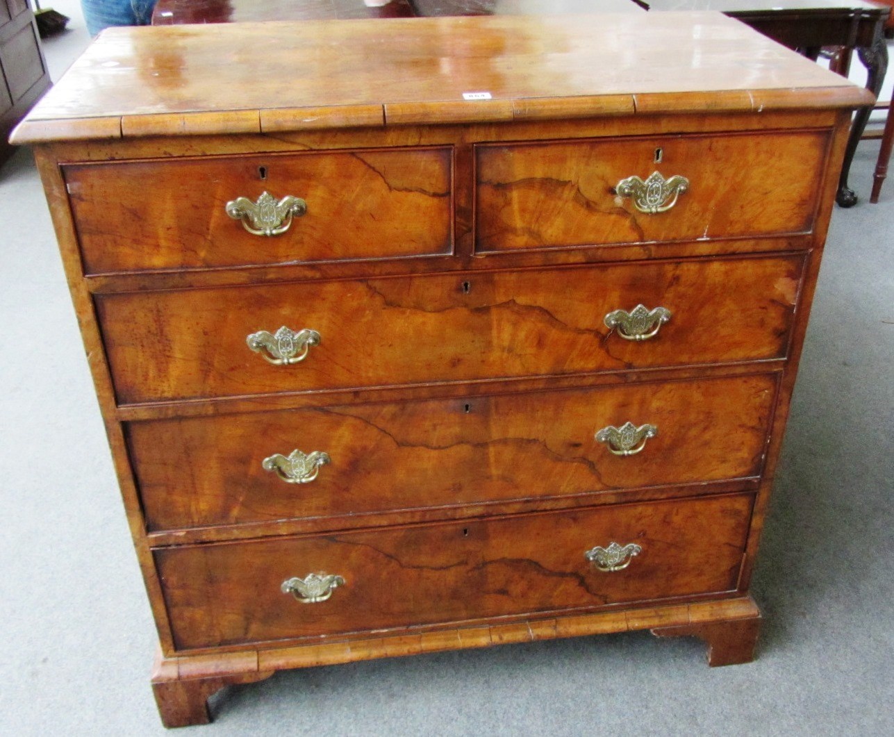 Appraisal: An th century figured walnut chest of two short and