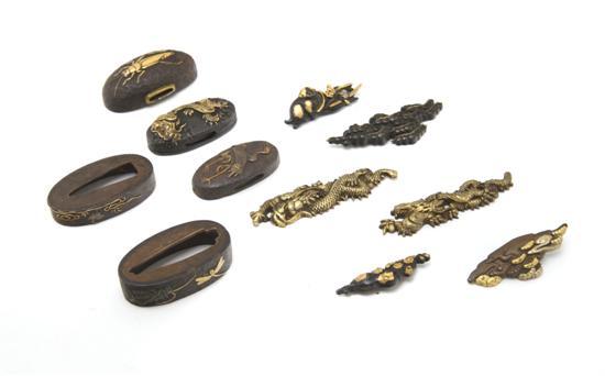 Appraisal: A Collection of Japanese Sword Fittings comprised of an iron