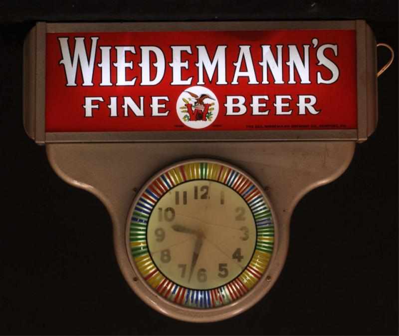 Appraisal: Wiedemann's Clock Spinner Description s White neon encased in metal