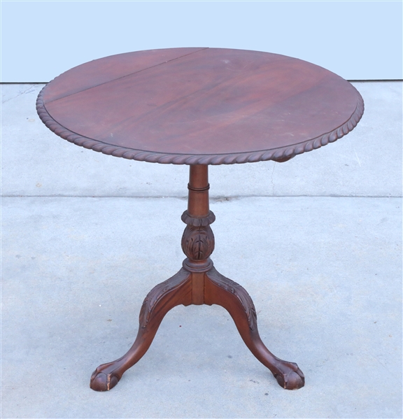 Appraisal: Vintage American flip top mahogany table with carved detail overall