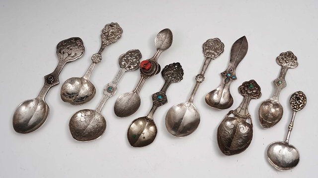 Appraisal: A collection of ten Tibetan silver spoons th Centurysome inset