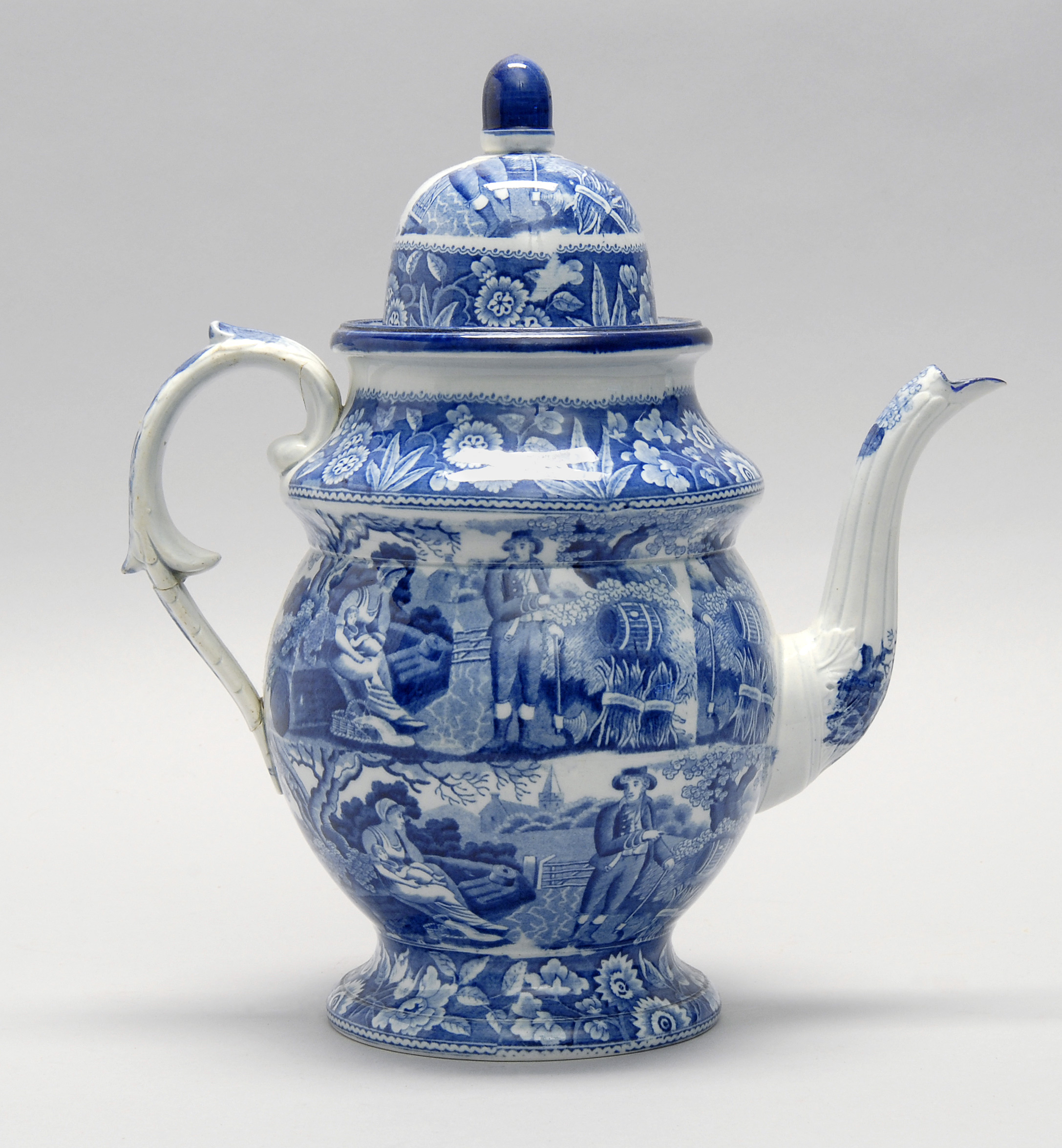 Appraisal: TRANSFERWARE TEAPOT th CenturyWith blue and white figural decoration Handle