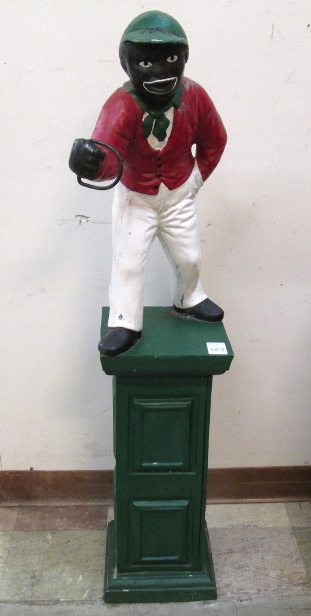 Appraisal: BLACK AMERICANA STYLE LAWN JOCKEY a Jocko style hitching post