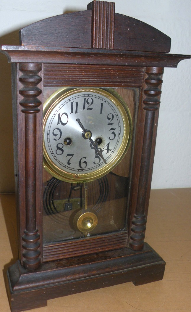 Appraisal: An early thC pine and oak cased mantel clock the