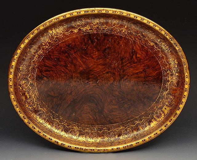 Appraisal: A REGENCY PAPIER MACH OVAL TEA TRAY with faux bois