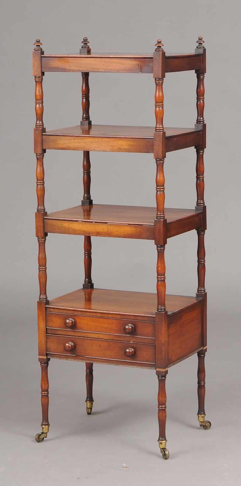 Appraisal: REGENCY MAHOGANY WHATNOT Incorporating four shelves and a base drawer