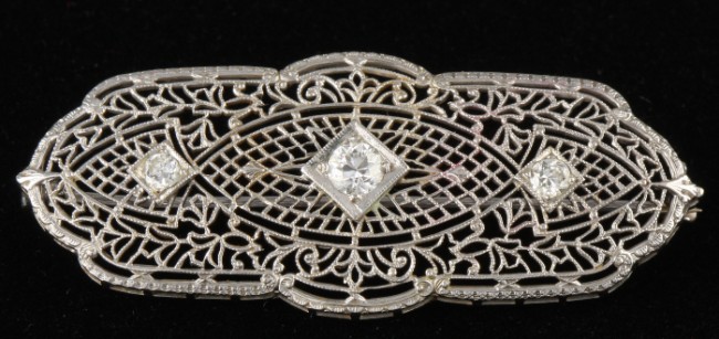 Appraisal: KW filigree and diamond pin with three round diamonds approximately