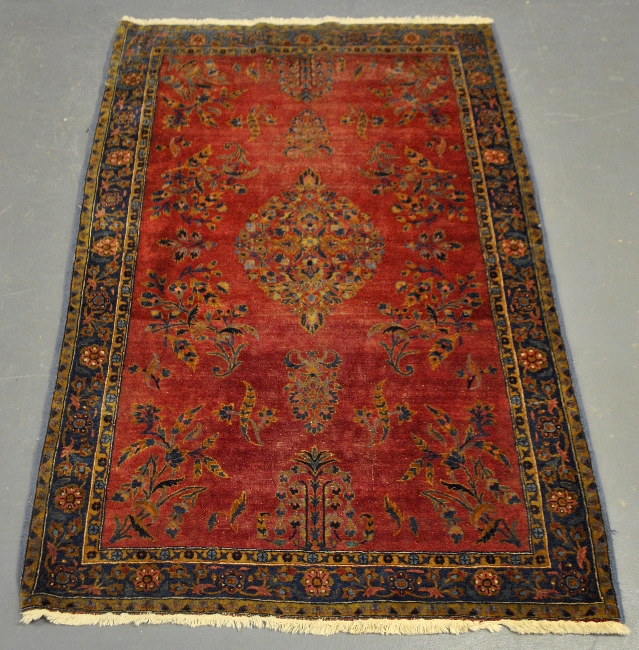 Appraisal: - Kerman oriental hall carpet with red field and floral