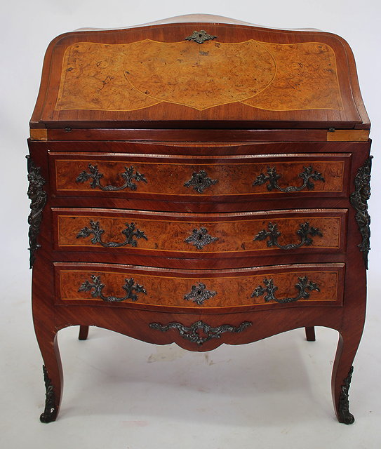 Appraisal: A TH CENTURY FRENCH STYLE WALNUT BUREAU with serpentine top