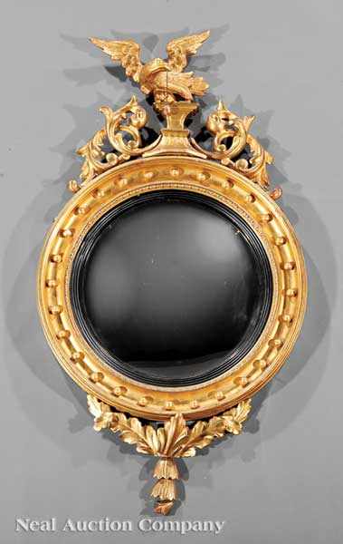 Appraisal: An American or English Carved Giltwood Convex Mirror th c