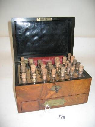 Appraisal: A WALNUT CASED DOMESTIC HOMEOPATHY CHEST c of oblong form