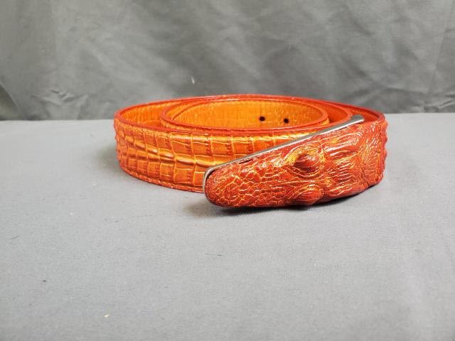 Appraisal: Vintage reddish orange alligator belt with an a small alligator