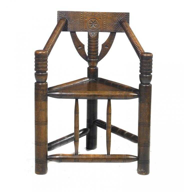 Appraisal: AN OAK REPLICA OF THE WARWICK CHAIR of turned construction