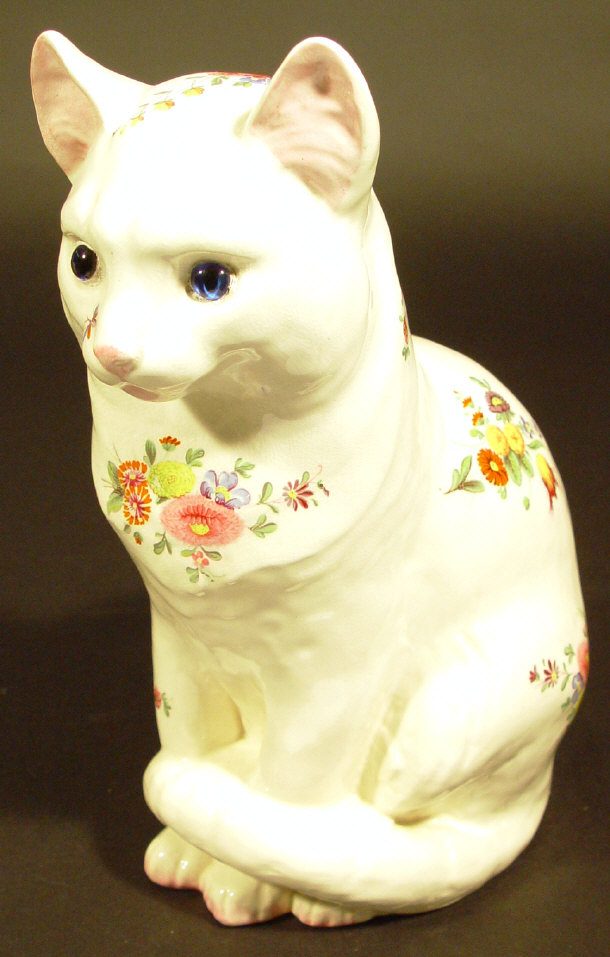 Appraisal: Plichta cat printed with flowers and set with blue glass