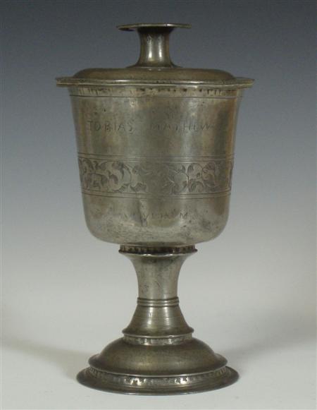 Appraisal: A pewter chalice and cover bell bowl concave reeded stem