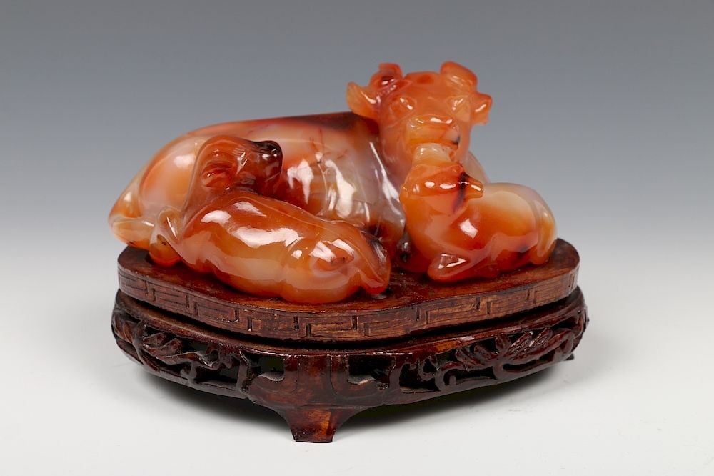 Appraisal: CHINESE AGATE BUFFALO CARVING WITH STAND A vivid carving of