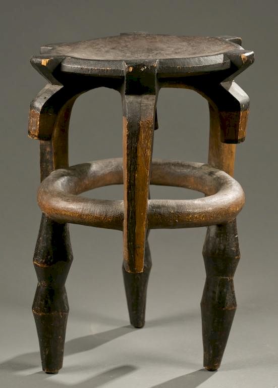 Appraisal: Tanzanian stool th c A four legged wooden stool Tanzania