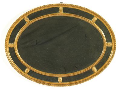 Appraisal: A late Victorian giltwood oval mirror in Adam style with