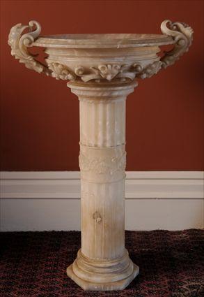 Appraisal: ITALIAN CARVED ALABASTER FOUNTAIN The hemispherical basin with two mask-carved