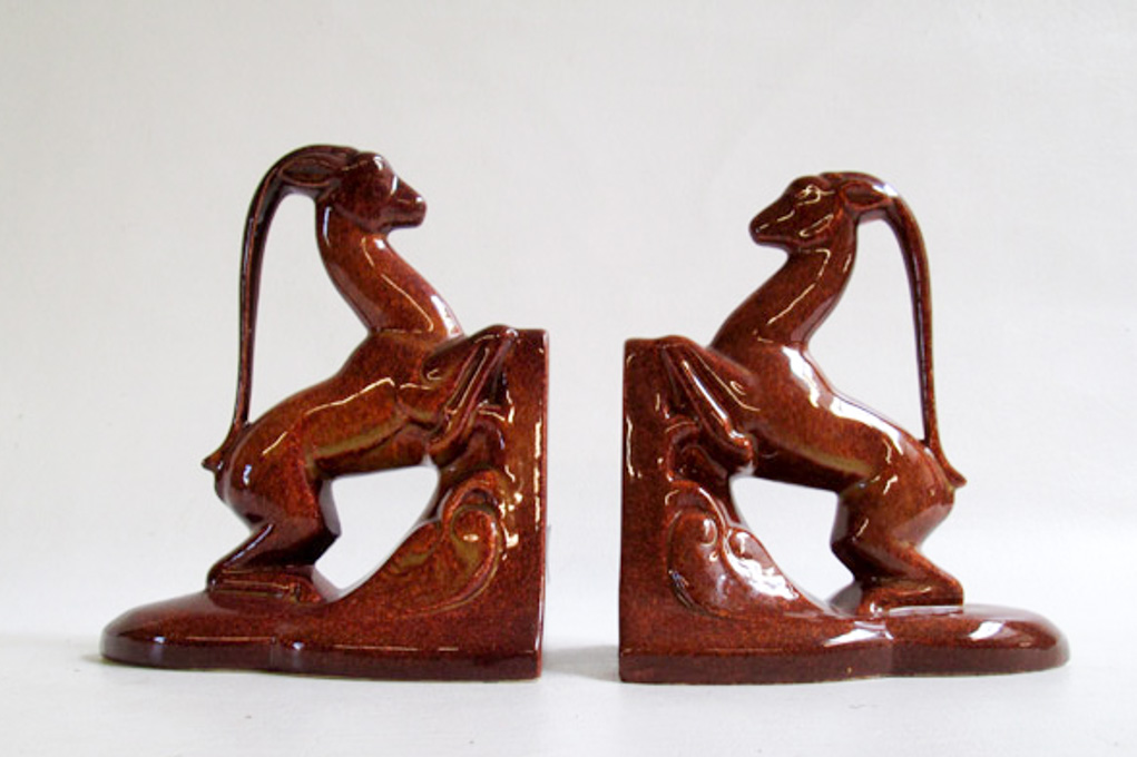 Appraisal: PAIR COWAN POTTERY UNICORN BOOKENDS designed by Waylande Gregory ochre