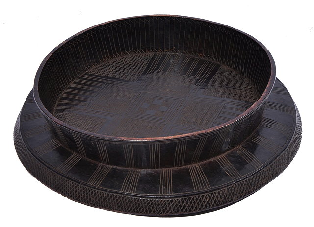 Appraisal: AN ETHIOPIAN CARVED WOODEN CIRCULAR LOW TRAY TOP TABLE with