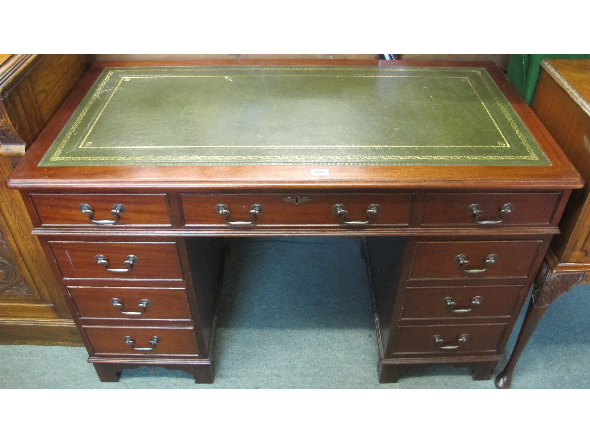 Appraisal: A mahogany leather topped pedestal desk