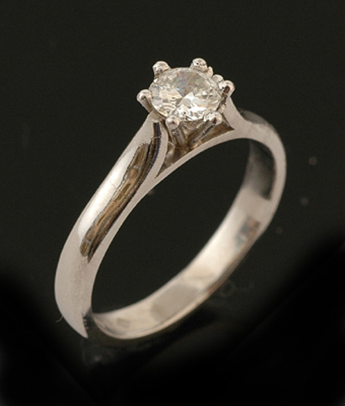 Appraisal: A diamond solitaire ring The round brilliant cut diamond weighing