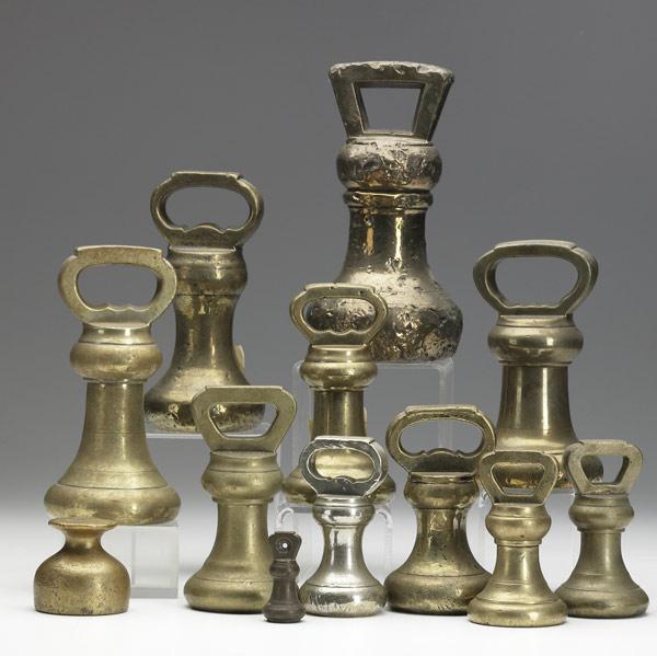 Appraisal: ENGLISH BRASS WEIGHTS Grouping of twelve mostly bell-shaped with various