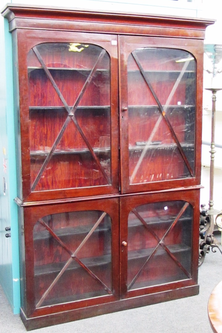 Appraisal: A th century mahogany shallow double height glazed four door