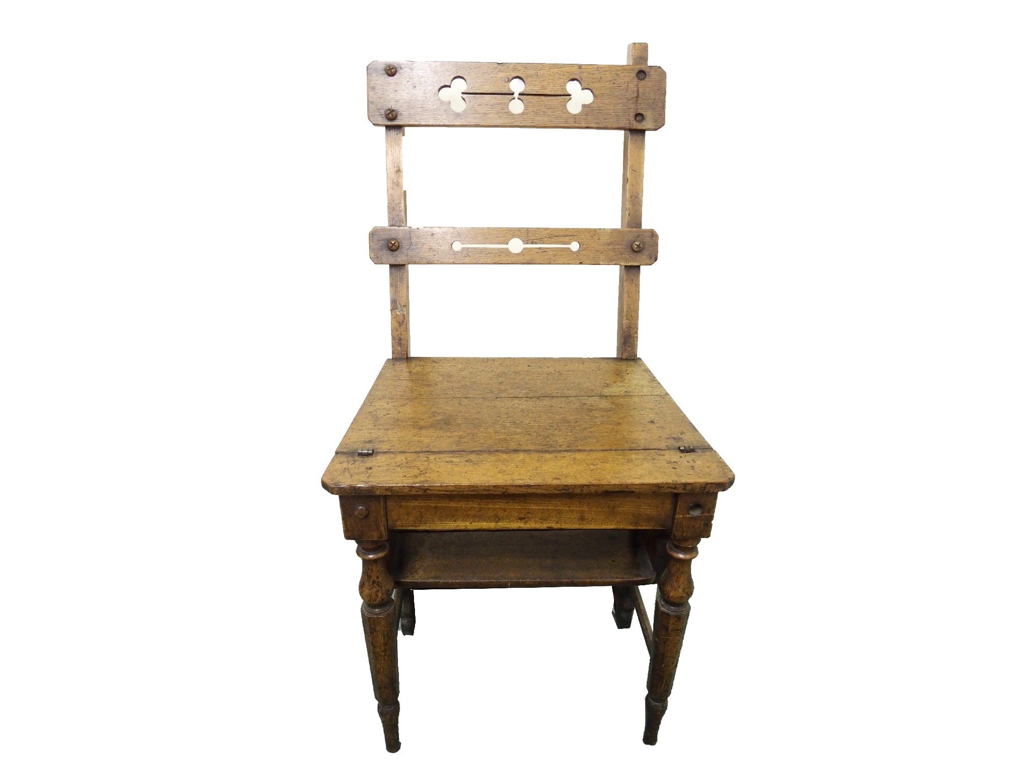 Appraisal: A Victorian oak library chair stepwith pierced back rails above