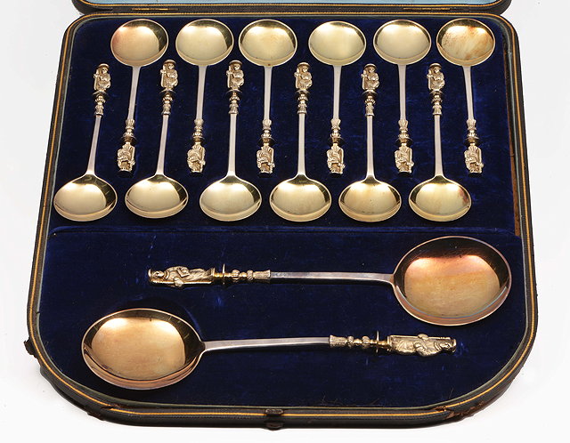 Appraisal: A CASED SET OF TWELVE SILVER PLATED APOSTLE TOPPED ICE