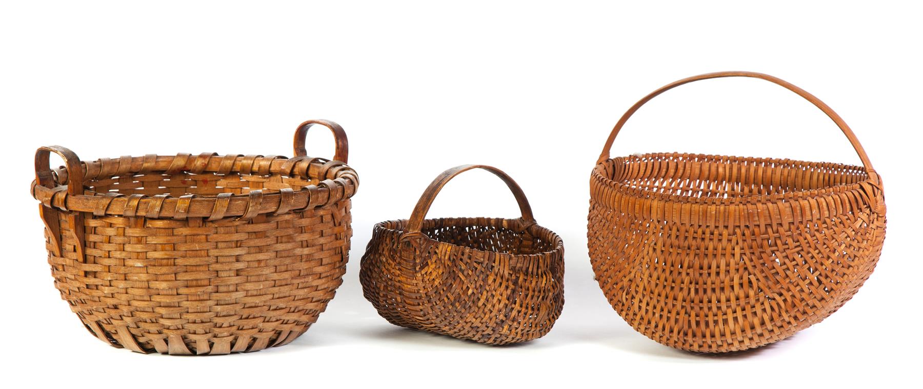 Appraisal: THREE BASKETS American th century Two buttocks baskets with central