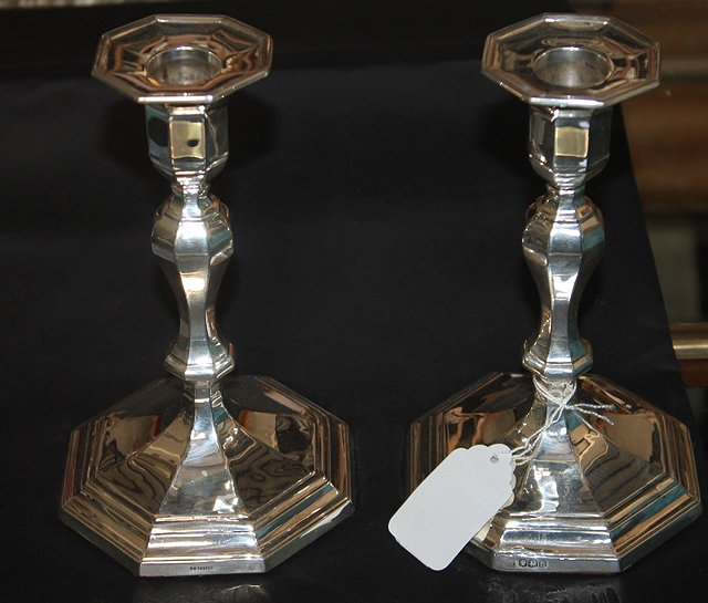 Appraisal: A PAIR OF GEORGIAN STYLE SILVER CANDLESTICKS of tapering octagonal