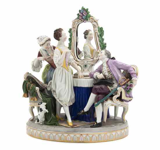 Appraisal: A Continental Porcelain Figural Group depicting a gentleman and two