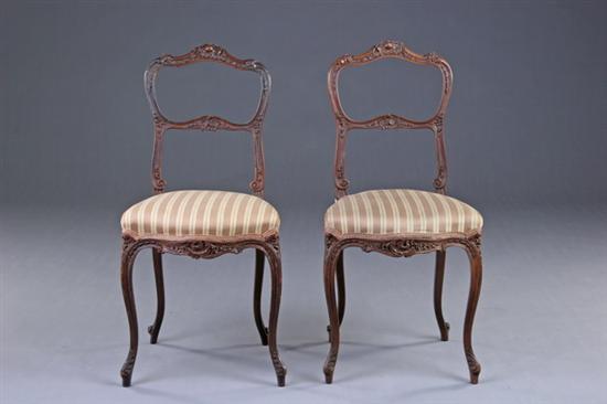 Appraisal: PAIR LOUIS XV STYLE MUSIC CHAIRS late th century fruitwood