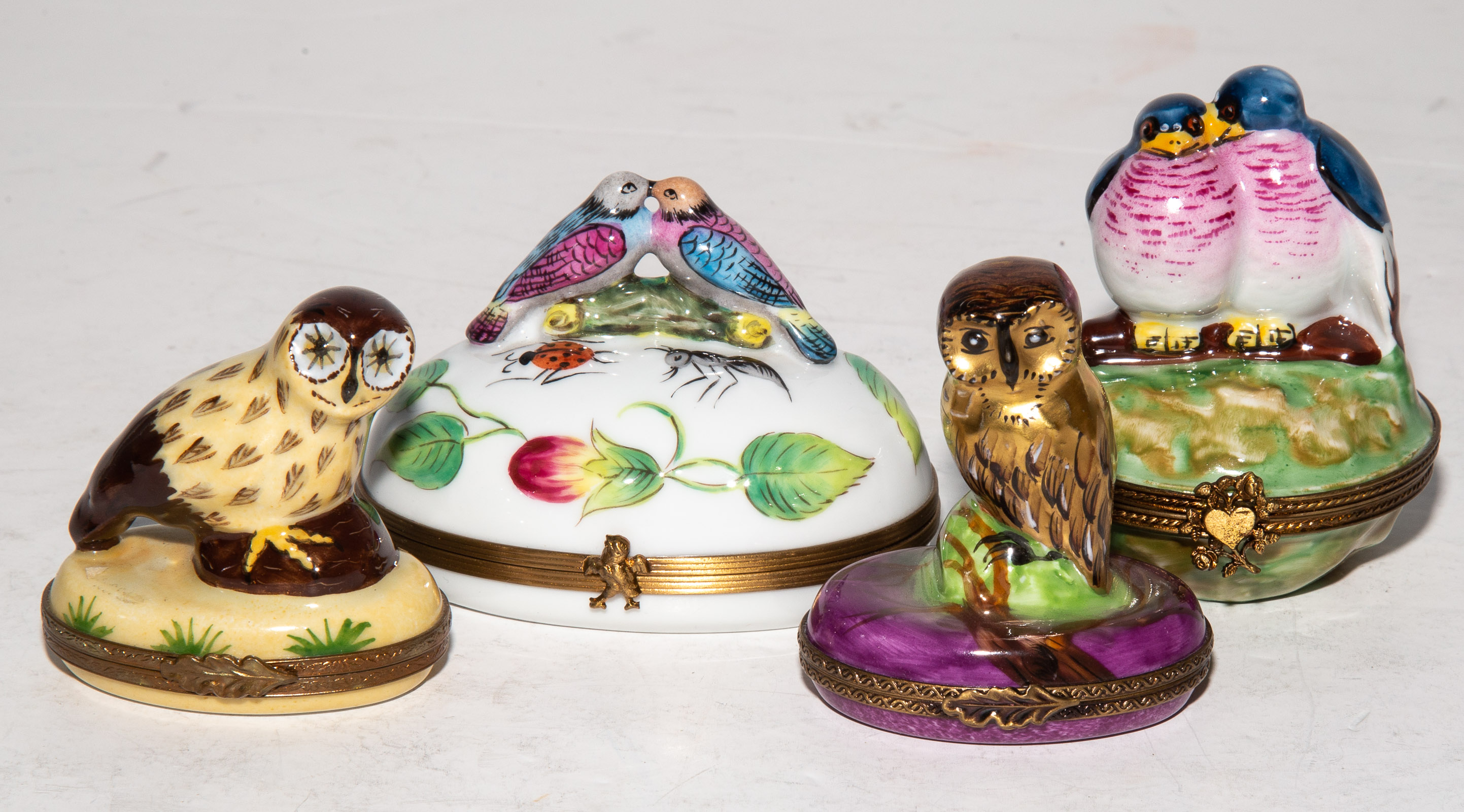 Appraisal: FOUR LIMOGES PORCELAIN BOXES WITH BIRDS OWLS Later th century