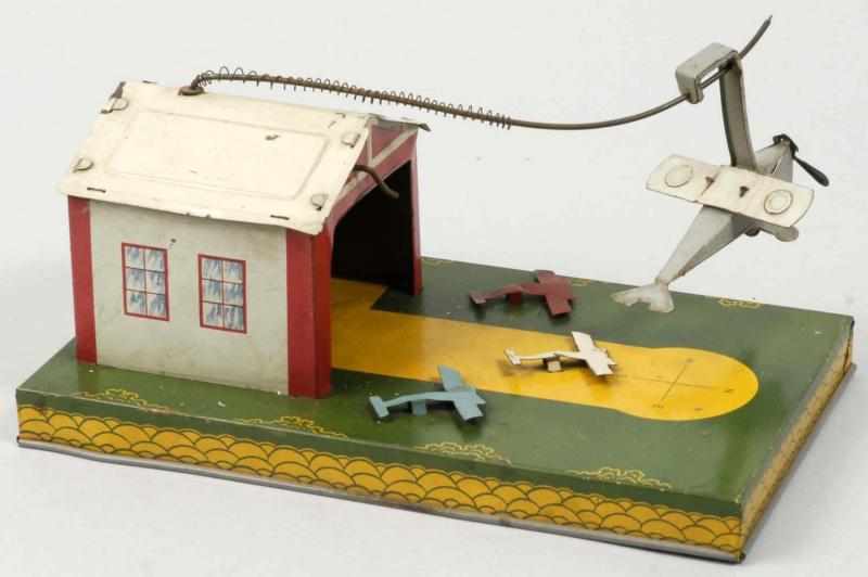 Appraisal: Tin Litho Katz Airplane Wind-Up Toy Description Working Marked Catapult