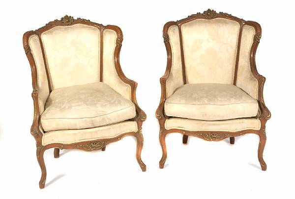 Appraisal: A pair of Louis XV style parcel gilt bergeres height