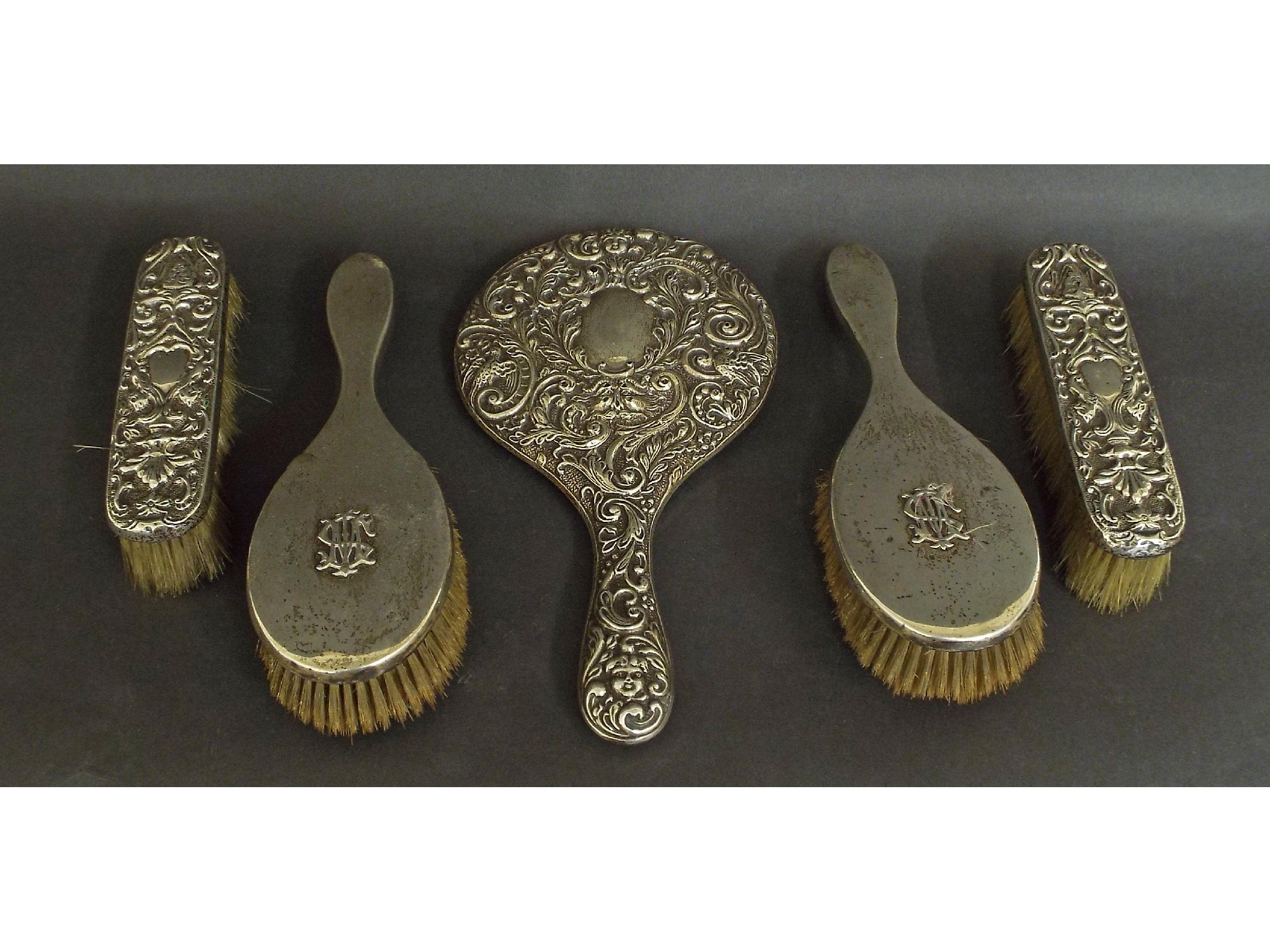 Appraisal: Two late Victorian silver dressing brushes embossed with the monogram