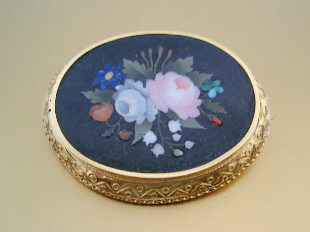 Appraisal: An oval micro mosaic brooch of cm x cm showing