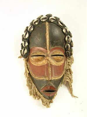 Appraisal: A polychrome decorated Dan mask with a fibre beard and