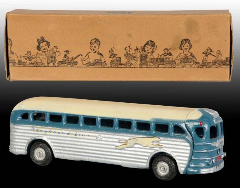 Appraisal: Cast Iron Arcade Greyhound Bus Toy in OB Description Includes