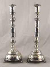 Appraisal: A pair of Russian silver candlesticks marked M P Kokoshnik