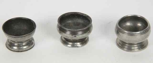 Appraisal: Three late th Century pewter cup salts of squat circular